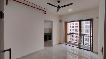 Living Room in 2 BHK Apartment at Sunteck Maxxworld, Naigaon East – for Rent