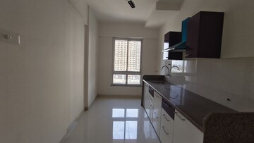 Kitchen in 2 BHK Apartment at Puranik Rumah Bali, Ghodbunder Road – for Sale