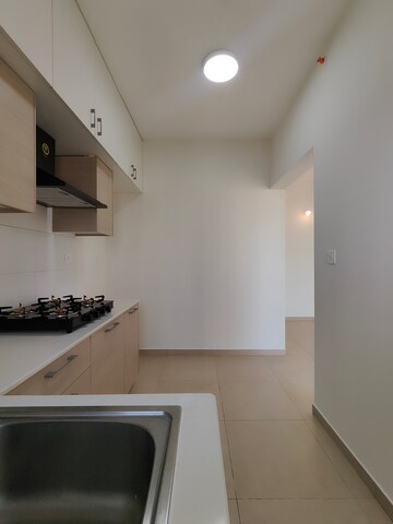 Kitchen in 2 BHK Apartment at Bhartiya Nikoo Homes Phase 2, Thanisandra Main Road – for Sale