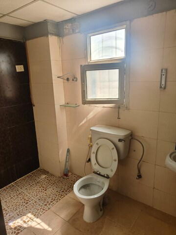 Bathroom in 3 BHK Apartment at Mahagun Mascot, Sain Vihar – for Sale