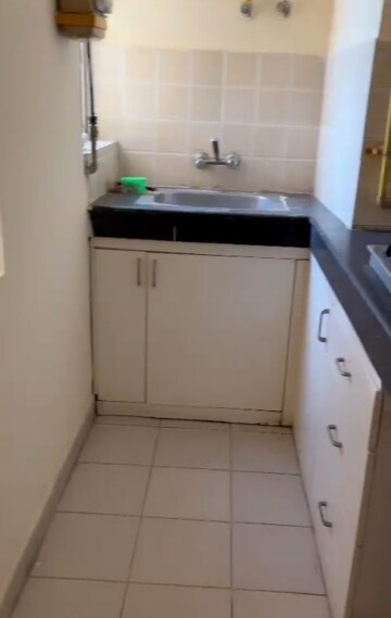 Kitchen in 1 BHK Apartment at Paras Seasons, Sector 168 – for Rent