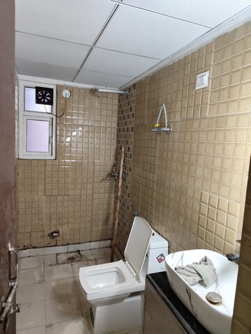 Bathroom in 2 BHK Apartment at Aims Golf City, Sector 75 – for Rent