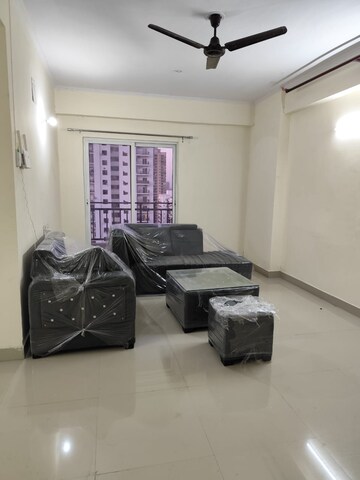 Living Room in 2 BHK Apartment at Aims Golf City, Sector 75 – for Rent