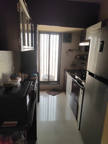Kitchen in 2 BHK Apartment at Unique Aurum, Mira Road – for Sale
