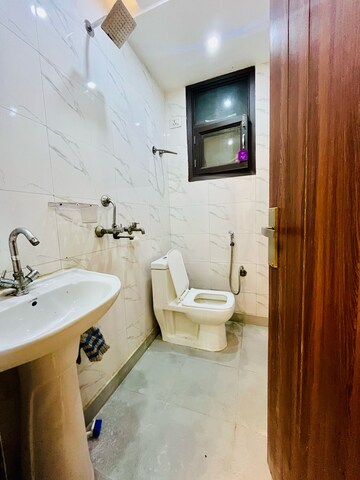 Bathroom in 3 BHK Builder Floor at Dwarka Mor – for Rent
