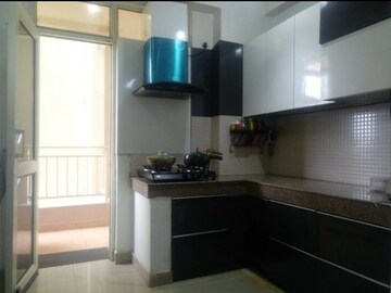 Kitchen in 2 BHK Apartment at Charms Castle, Raj Nagar Extension – for Rent