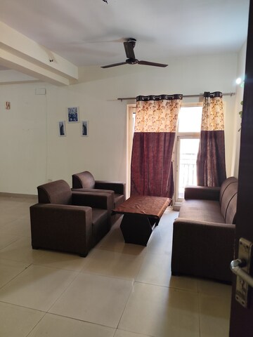 Living Room in 3 BHK Apartment at Aims Golf City, Sector 75 – for Rent