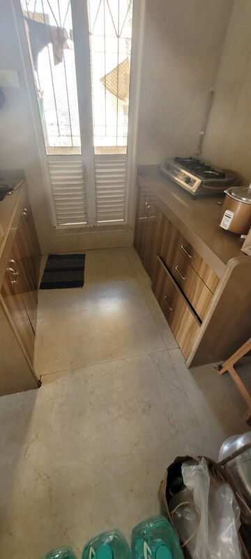 Kitchen in 1.5 BHK Apartment at Dosti West County, Balkum Pada – for Rent