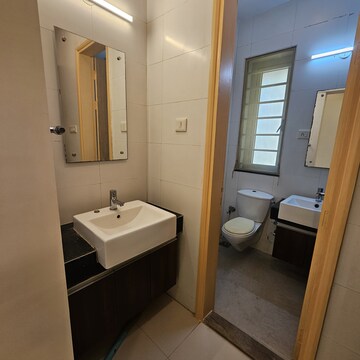 Bathroom in 4 BHK Apartment at Sheth Vasant Lawns, Oswal Park – for Rent