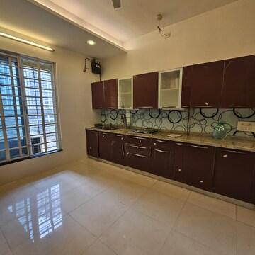 Kitchen in 4 BHK Apartment at Sheth Vasant Lawns, Oswal Park – for Rent
