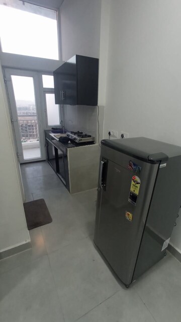 Kitchen in Studio Apartment at DAH Greentech NX Corporate Suites, Tech Zone 4 Greater Noida – for Rent