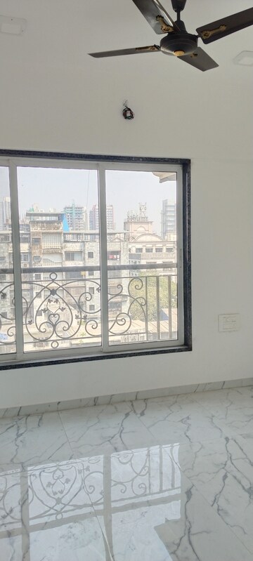 Bedroom in 3 BHK Apartment at New Happy Life CHS, Mulund West – for Rent