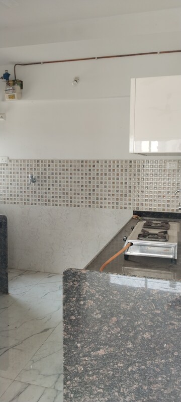 Kitchen in 3 BHK Apartment at New Happy Life CHS, Mulund West – for Sale
