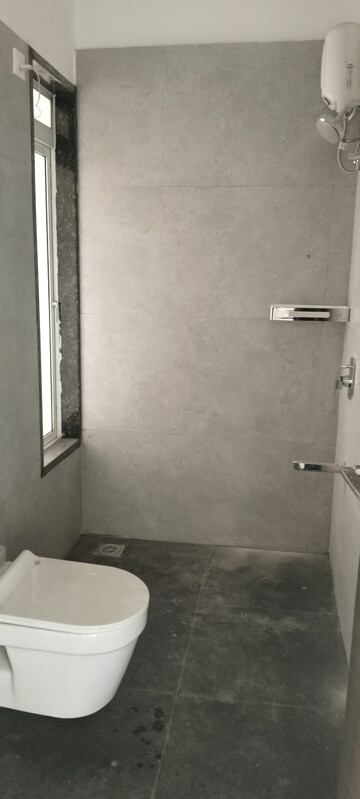 Bathroom in 3 BHK Apartment at New Happy Life CHS, Mulund West – for Sale