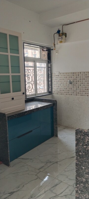 Kitchen in 3 BHK Apartment at New Happy Life CHS, Mulund West – for Sale