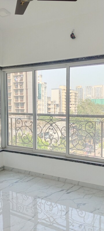 Bedroom in 3 BHK Apartment at New Happy Life CHS, Mulund West – for Sale