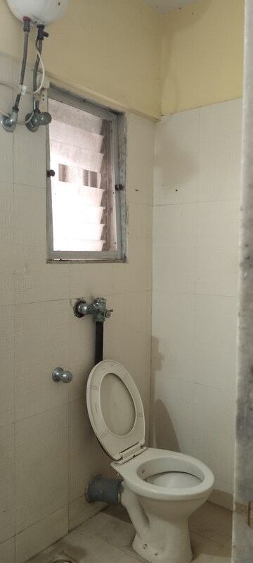 Bathroom in 2 BHK Apartment at Royal Classic, Mulund West – for Rent