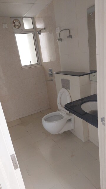 Bathroom in 3 BHK Apartment at Cosmos Express 99, Sector 99 – for Sale