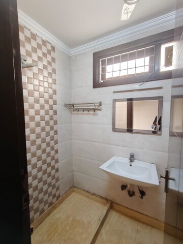 Bathroom in 2 BHK Apartment at Lajpat Nagar – for Sale