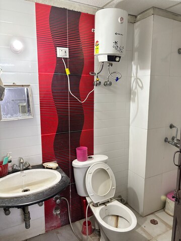 Bathroom in 3 BHK Apartment at Gulmohur Garden, Raj Nagar Extension – for Rent