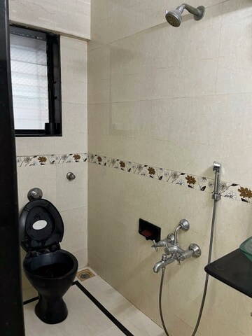 Bathroom in 2 BHK Apartment at Asha Nagar CHS, Mulund West – for Rent