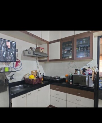 Kitchen in 1.5 BHK Apartment at Silver Park, Mira Road – for Sale