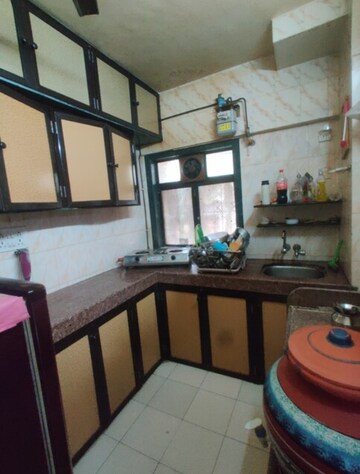 Kitchen in 2 BHK Apartment at Eden Rose Apartment, Mira Road – for Rent