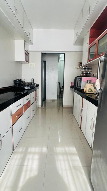 Kitchen in 2 BHK Apartment at Siddhi CHS Sanpada, Sanpada – for Rent