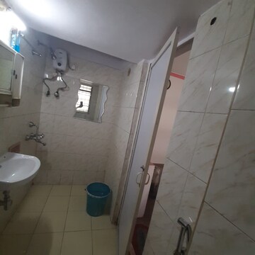 Bathroom in 2 BHK Apartment at Dheeraj Uphar CHS. LTD., Malad East – for Rent