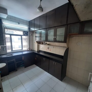 Kitchen in 2 BHK Apartment at Dheeraj Uphar CHS. LTD., Malad East – for Rent