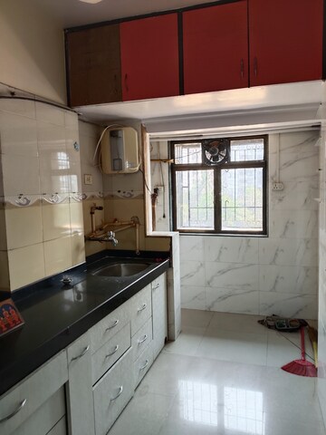 Kitchen in 1 BHK Apartment at Millennium Cooperative Housing Society, Goregaon West – for Rent