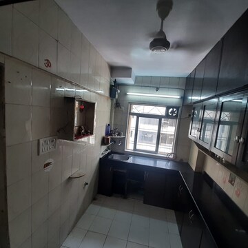 Kitchen in 2 BHK Apartment at Dheeraj Uphar CHS. LTD., Malad East – for Rent