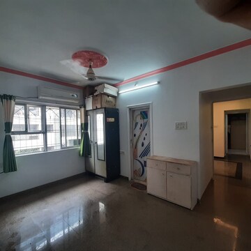 Living Room in 2 BHK Apartment at Dheeraj Uphar CHS. LTD., Malad East – for Rent