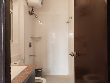 Bathroom in 3 BHK Apartment at Moti Nagar – for Rent