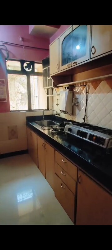 Kitchen in 1 BHK Apartment at Solanki Dham CHS, Louis Wadi – for Rent