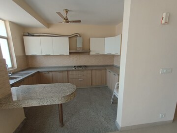 Kitchen in 3 BHK Apartment at Raheja Vedaanta, Sector 108 – for Rent