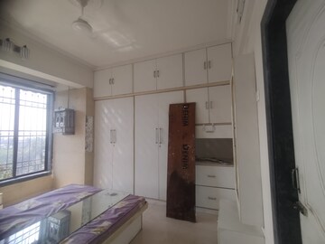 Bedroom in 3 BHK Apartment at Nandidham CHS, Seawoods – for Rent