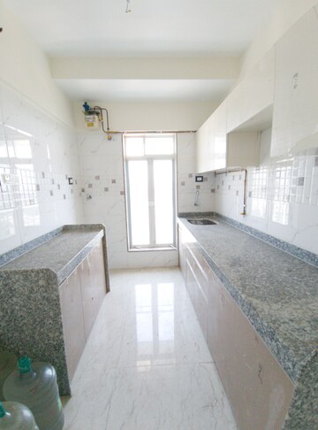 Kitchen in 1 BHK Apartment at Apex Green Wood, Borivali East – for Sale