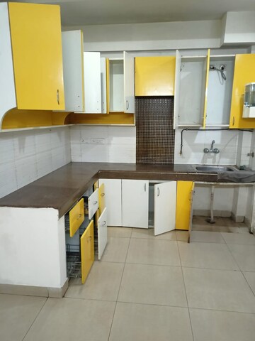 Kitchen in 2.5 BHK Apartment at Exotica Dreamville, Sector 16c Greater Noida – for Rent