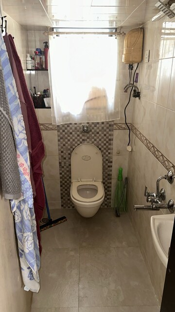 Bathroom in 1 BHK Apartment at Sagar Sanjog CHS, Andheri West – for Rent