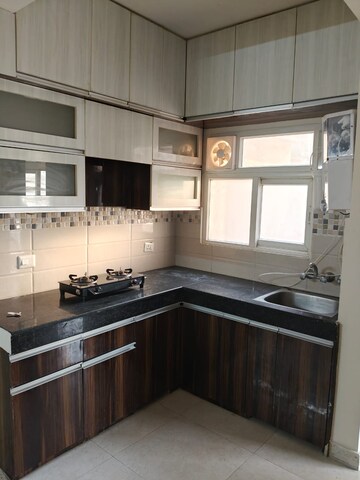 Kitchen in 2 BHK Apartment at Signature Global Orchard Avenue, Sector 93 – for Rent