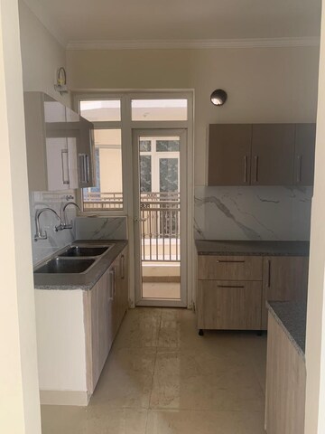 Kitchen in 3 BHK Apartment at Affinity Greens, International Airport Road – for Sale