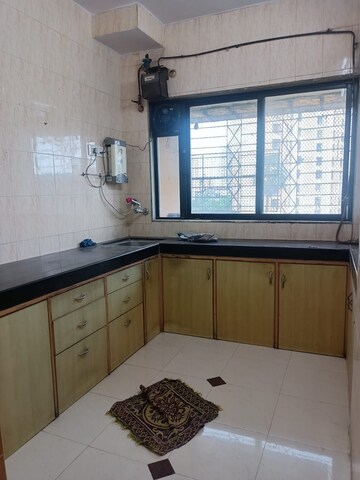 Kitchen in 1 BHK Apartment at Green Acres Apartment, Waghbil – for Rent