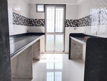 Kitchen in 2 BHK Apartment at Neel Sidhi Orbit, New Panvel – for Rent