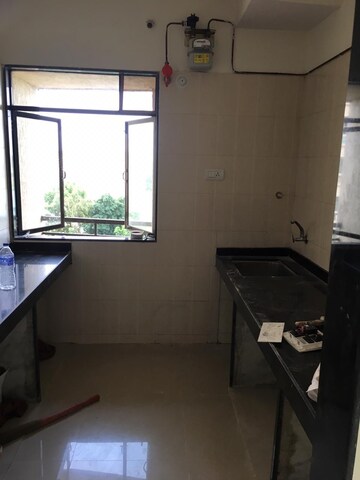 Kitchen in 2 BHK Apartment at Shivneri Tower, Brahmand – for Sale
