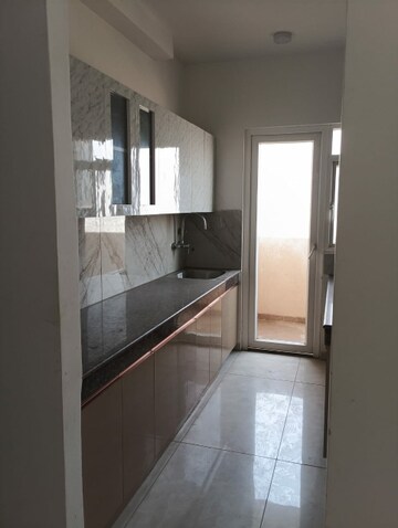 Kitchen in 3 BHK Apartment at ACE Parkway, Sector 150 – for Rent