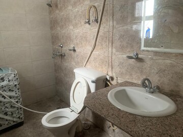 Bathroom in 3 BHK Builder Floor at Guru Nanak Enclave, Dhakoli Village – for Rent
