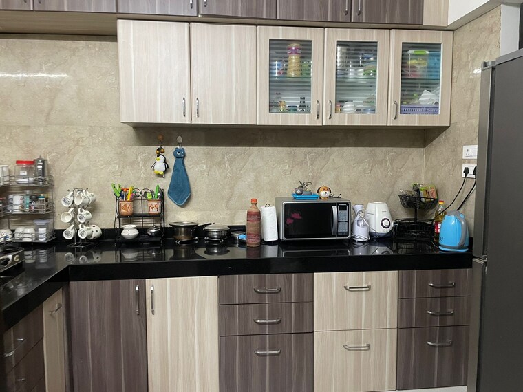 Kitchen, bhandari-7-plumeria-drive 2 Bedroom 920 Sq.Ft. Apartment In Tathawade Pune 8349872
