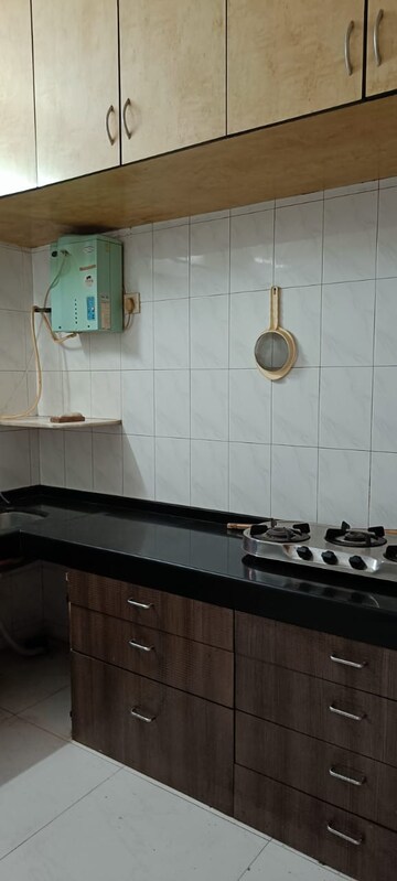Kitchen in 1.5 BHK Apartment at Varsha Milan CHS, Chakala – for Rent
