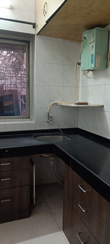 Kitchen in 1.5 BHK Apartment at Varsha Milan CHS, Chakala – for Rent
